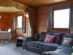 a living room with a couch and a table at Loch Arkaig in Banavie