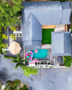 an overhead view of a house with a swimming pool at Avita Pool Villa in Sichon
