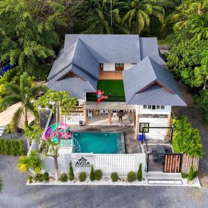 an aerial view of a house with a swimming pool at Avita Pool Villa in Sichon