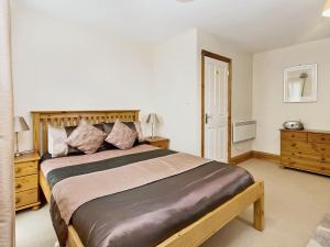 a bedroom with a large bed in a room at Trueman - W41948 in Filey