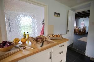 a kitchen with a counter with some food on it at Granary - Ukc4684 in Clynnog-fawr