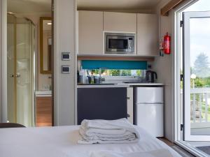 a kitchen with a table with a towel on it at Valley View - Uk50320 in Liskeard