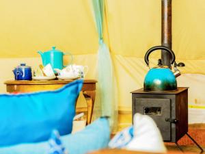a blue tea kettle sitting on top of a stove at Moroccan - Ukc5930 in Highclere