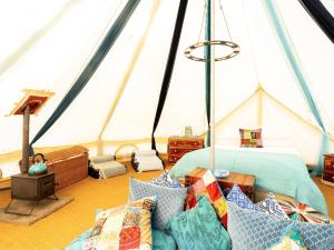 a room with a tent with a bed and pillows at Moroccan - Ukc5930 in Highclere