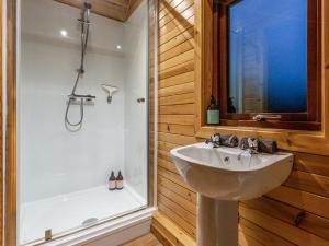 a bathroom with a sink and a shower at Here - Uk50566 in Port of Menteith