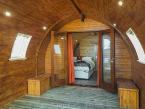 a room with an arched doorway and a bedroom at Here - Uk50566 in Port of Menteith