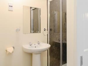 a bathroom with a sink and a shower at Dorn Rock View - Uk33918 in Portpatrick
