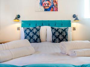 a bedroom with a bed with towels on it at The Cowshed - Uk37349 in Hockerton
