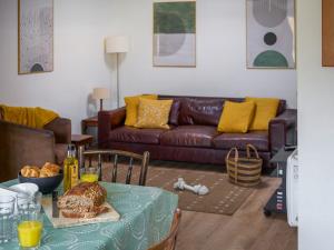 a living room with a table with a plate of food at Bueno - Ukc4682 in Clynnog-fawr