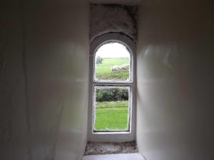 an open window in a building with sheep in the field at Skellgill House in Askrigg +5 photos