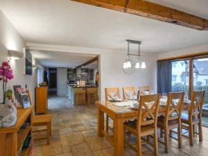 a dining room and kitchen with a table and chairs at Lower House Barn in Staunton on Wye