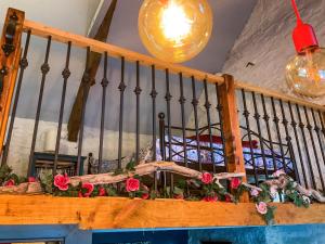 a balcony with flowers on a table in a room at Y Smithy - Uk49022 in Llanybyther