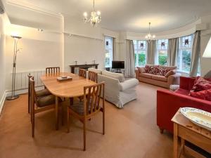 a living room with a table and a couch at Seawinds - Uk50857 in Colwyn Bay