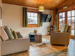 a living room with two couches and a table at Lodge 4 - Uk51264 in Glasgow