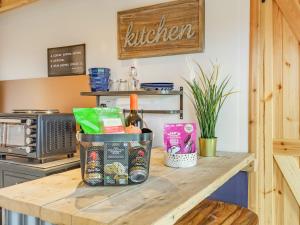 a kitchen counter with a basket of food on it at Holly's Hidden Hideaway - Uk36783 in Sutton Valence