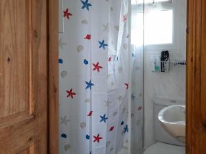 a bathroom with a shower curtain with stars on it at The Revie in Bridlington
