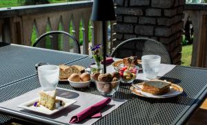a table with plates of food on top at B&B Mary in Alba