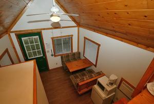 an overhead view of a living room in a cabin at Arrowhead Camping Resort Loft Cabin 22 in Douglas Center