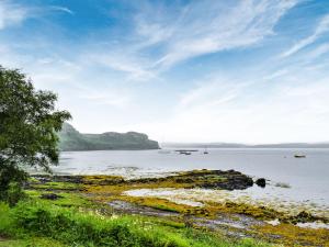 a view of a body of water with boats in it at The Duckling in Port na Long