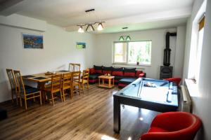 a living room with a couch and a table at Vila Roberta Breaza ,BV in Breaza