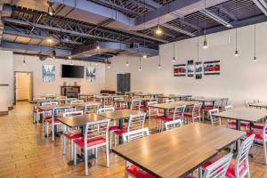 an empty dining room with tables and chairs at Comfort Inn Montreal - Laval - Highway 15 in Laval