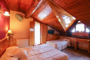 Postel nebo postele na pokoji v ubytování Roch Hotel