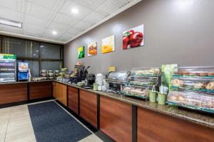 a fast food restaurant with a counter with food at Quality Inn & Suites Los Angeles Airport - Stadium District in Inglewood