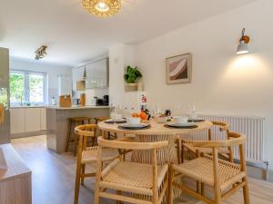 a kitchen and dining room with a table and chairs at Pentreath 4 in St Ives