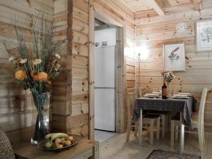 a dining room with a table and a refrigerator at Maple - Uk5501 in Killin