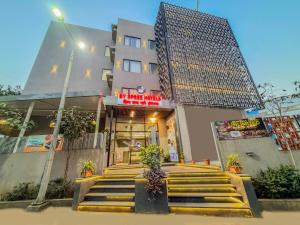 a building with stairs in front of a building at Zip By Spree Hotels Chinchwad in Chinchwad