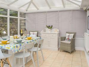 a dining room with a table and chairs at Seacliffe in Kildonan