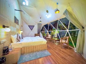 a bedroom with a bed in a tent at Glamo home kasauli in Kasauli