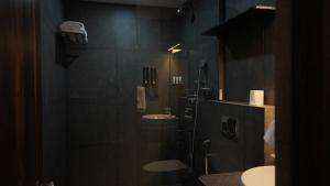 a bathroom with two sinks and a shower at Surf and Sand in Candolim +13 photos