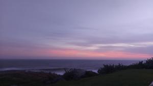 a view of the ocean at sunset at Nomads Nook 3 in Ramsgate