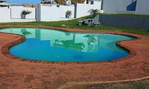a small swimming pool on a brick patio at Nomads Nook 3 in Ramsgate