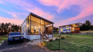 a truck parked in front of a tiny house at Red Hill Cabin#2 - 2-bedroom in Walcha