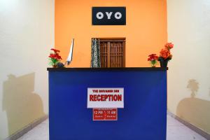 a podium with a sign that says the reinventing my reception at Hotel O The Shivansh Inn in Chandanpur