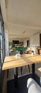 a large room with a table and pool tables at KAJI HOME in Pātan