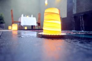 a yellow traffic cone sitting on the floor of a building at Jas Green Villas and Spa in Seminyak