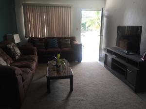 a living room with a couch and a coffee table at Beautiful 2 bedroom 1 bath in Tamuning