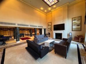 a living room with furniture and a skylight at The Bishop in London