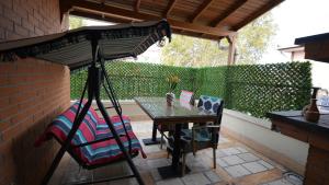 a patio with a table and a chair and an umbrella at CONCEPT HoUSE in Ankara