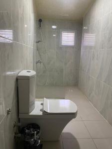 a bathroom with a toilet and a shower at Serge Otel in Arapkir +37 photos