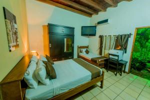 Ένα ή περισσότερα κρεβάτια σε δωμάτιο στο Hotel El Maltese