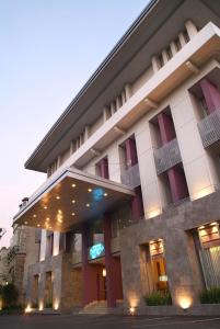 a large building with lights in front of it at Serela Riau by KAGUM Hotels in Bandung