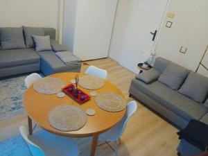 a living room with a table and a couch at Chillroom in Rąbień