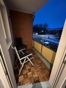 a laptop sitting on a chair on a balcony at City Apartment Schillerstraße in Wilhelmshaven