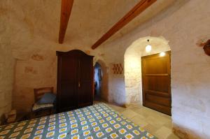 A bed or beds in a room at B&B La Gufa