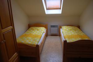 Postel nebo postele na pokoji v ubytování Apartmany U Stareho Labe