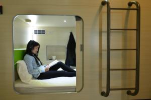 Postel nebo postele na pokoji v ubytování 深圳栖游青年旅馆Shenzhen Xi You Hostel